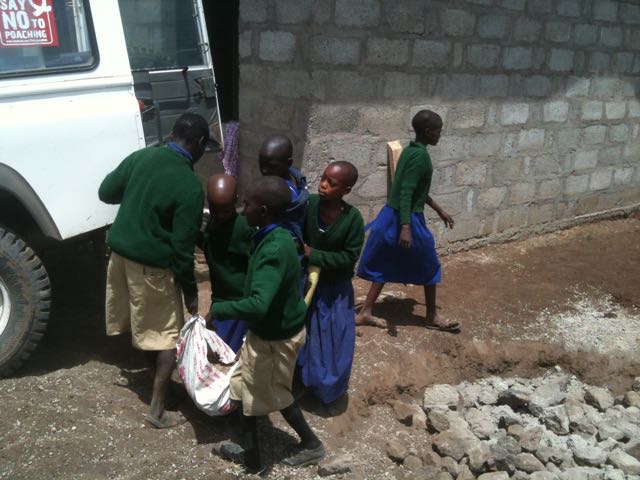 Kids helping to bring sand